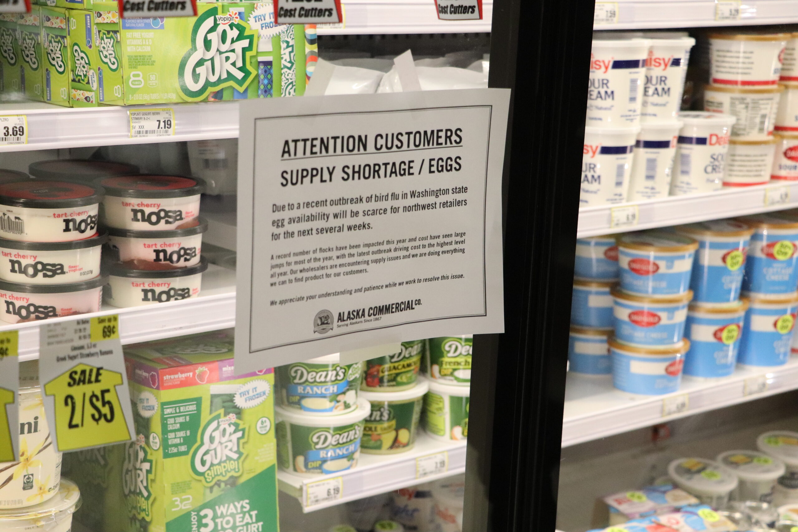 a sign says: Attention Customers - Supply shortage/Eggs