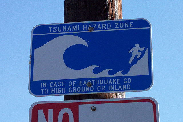 A sign says tsunami hazard zone