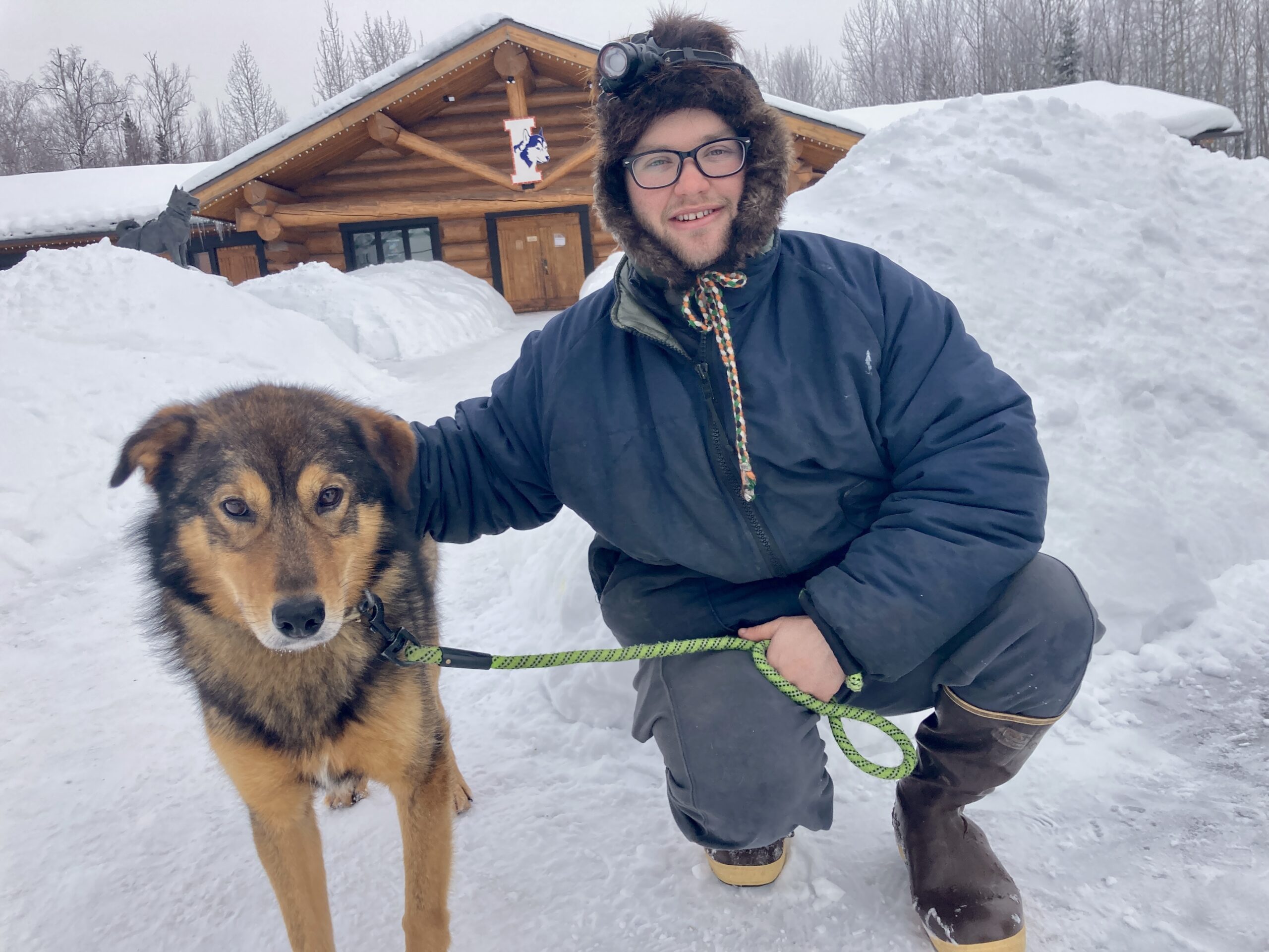 Hunter Keefe poses with his lead dog Senior at Iditarod Headquarters in Wasilla, Alaska.