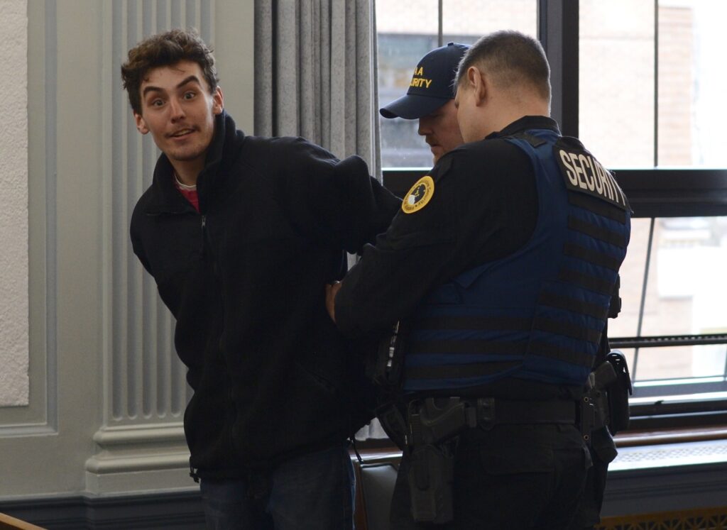 Fisheries protester removed from Alaska Capitol in handcuffs, arrested ...