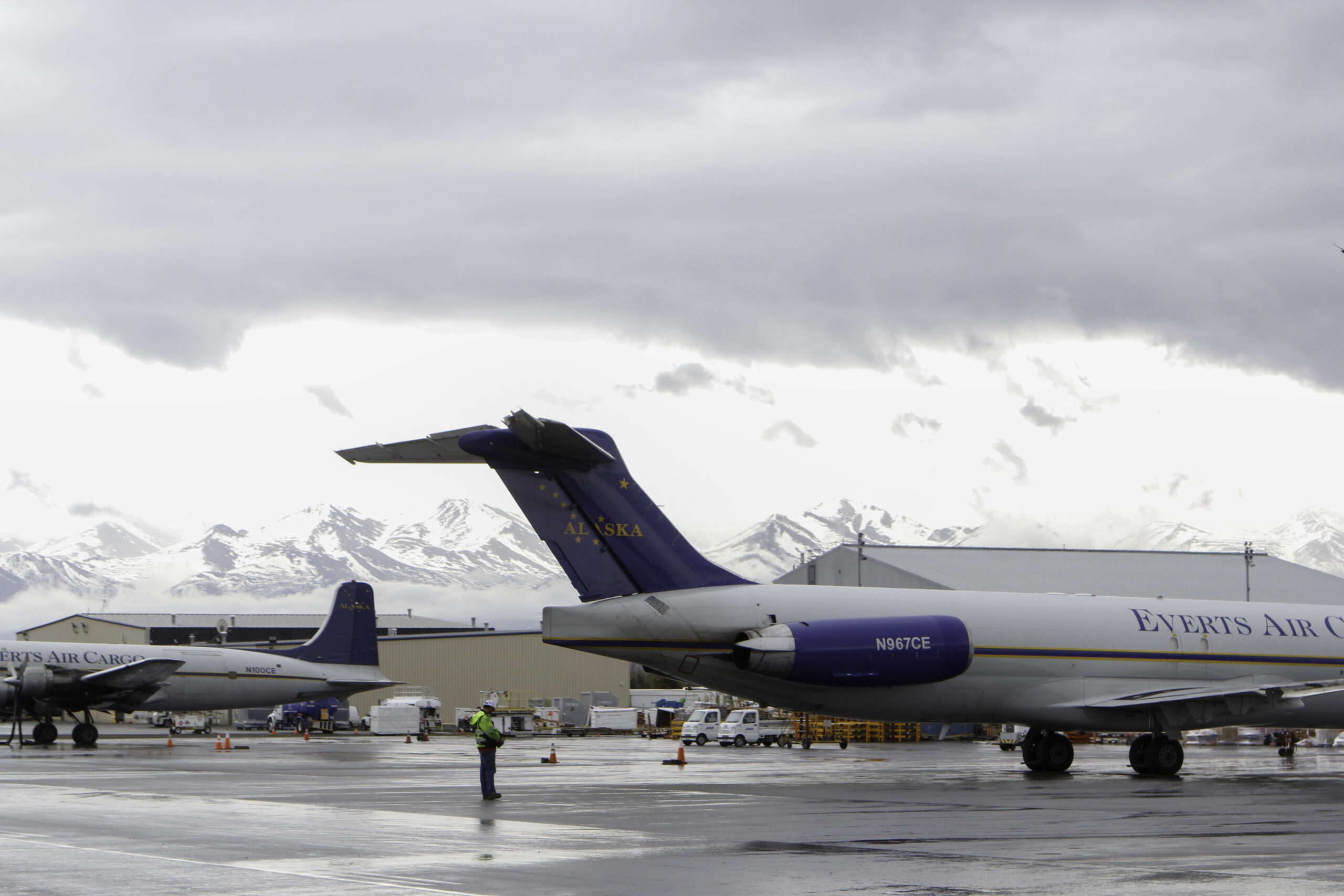 two airplanes side by side at the airport