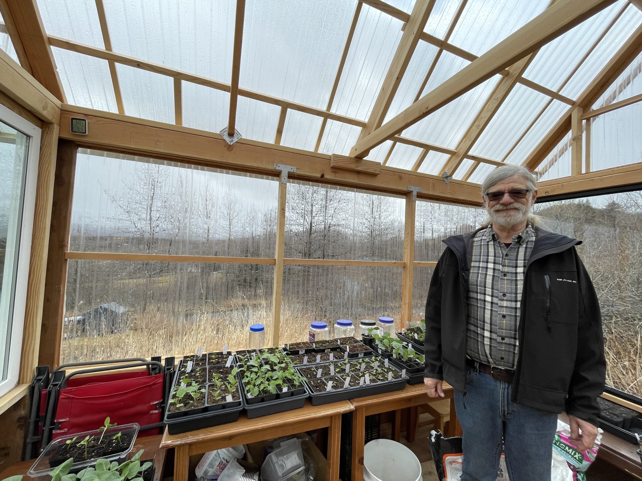 a man in a greenhouse