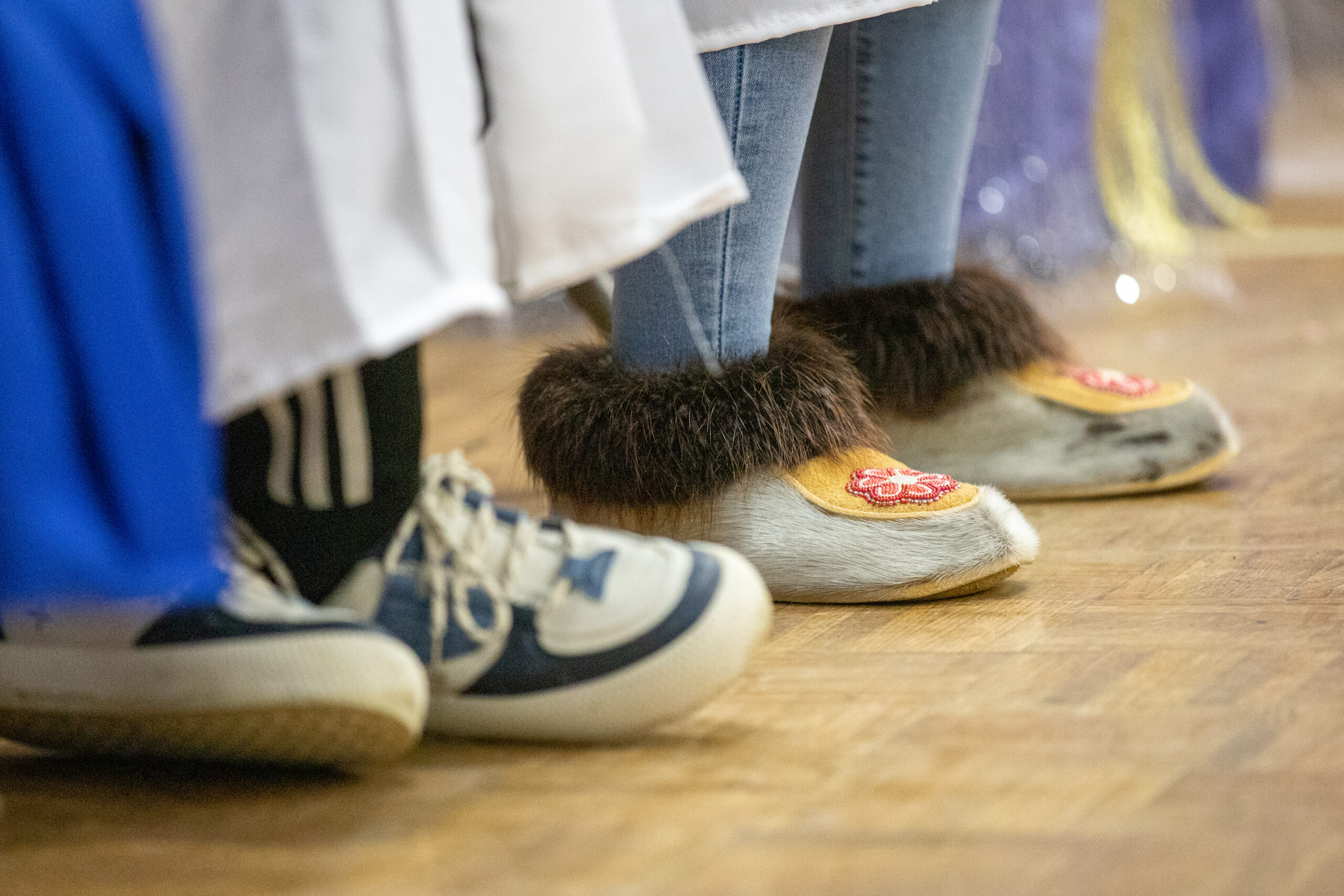 A pair of mukluks that one student wears with her graduation outfit.