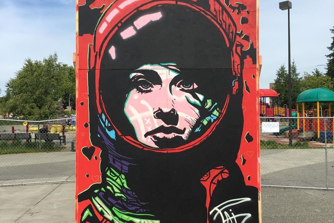 a large painting of a person in spacesuit