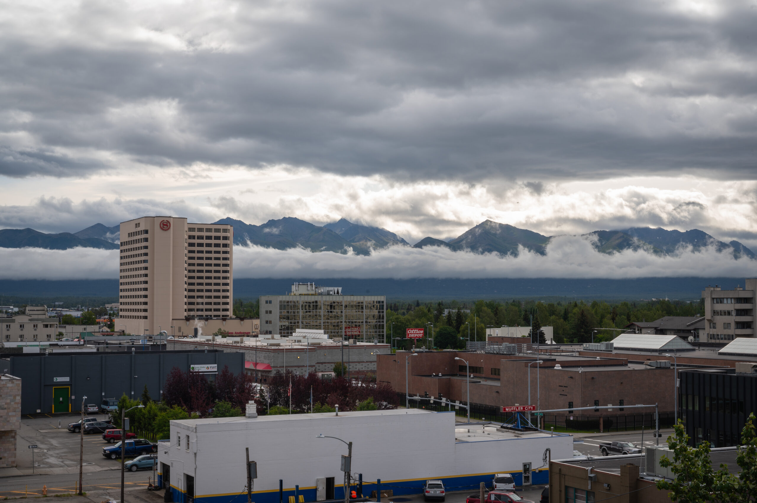 The Anchorage Skyline with rainy clouds and the Sheraton Hotel.