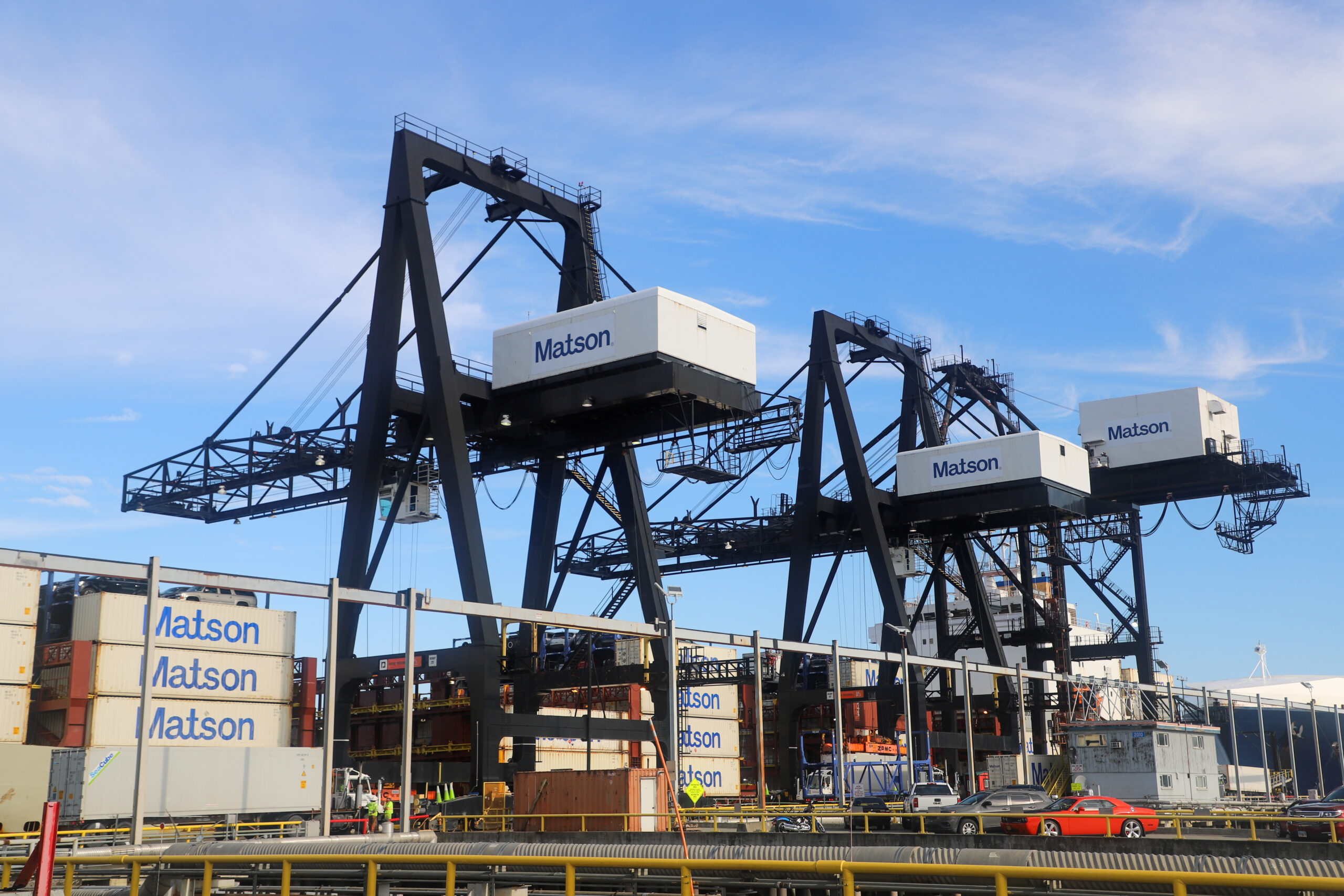 Large cranes and stacks of shipping containers