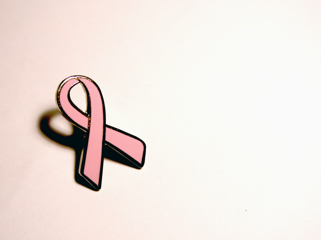 A pin of the pink ribbon used for breast cancer awareness month.