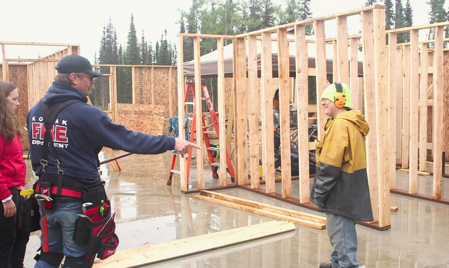 Construction workers in a partially framed home 