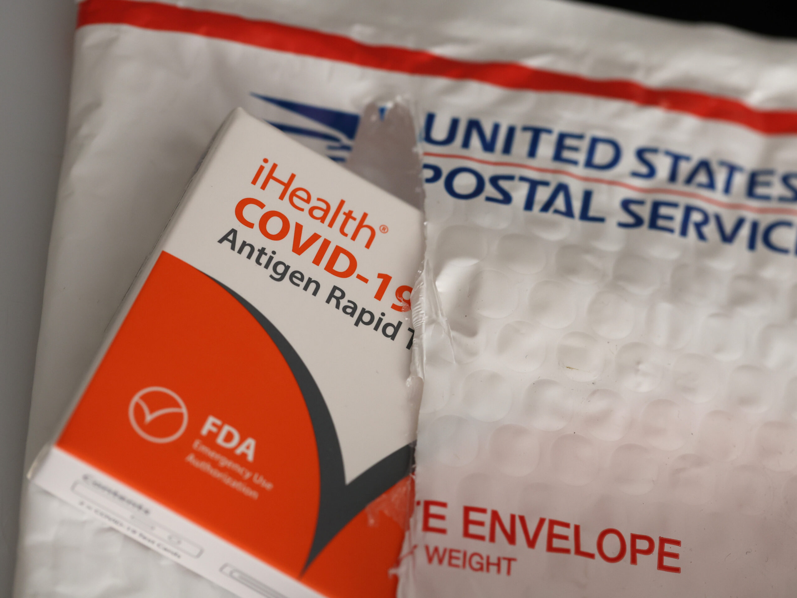 a covid test in a us postal service envelope