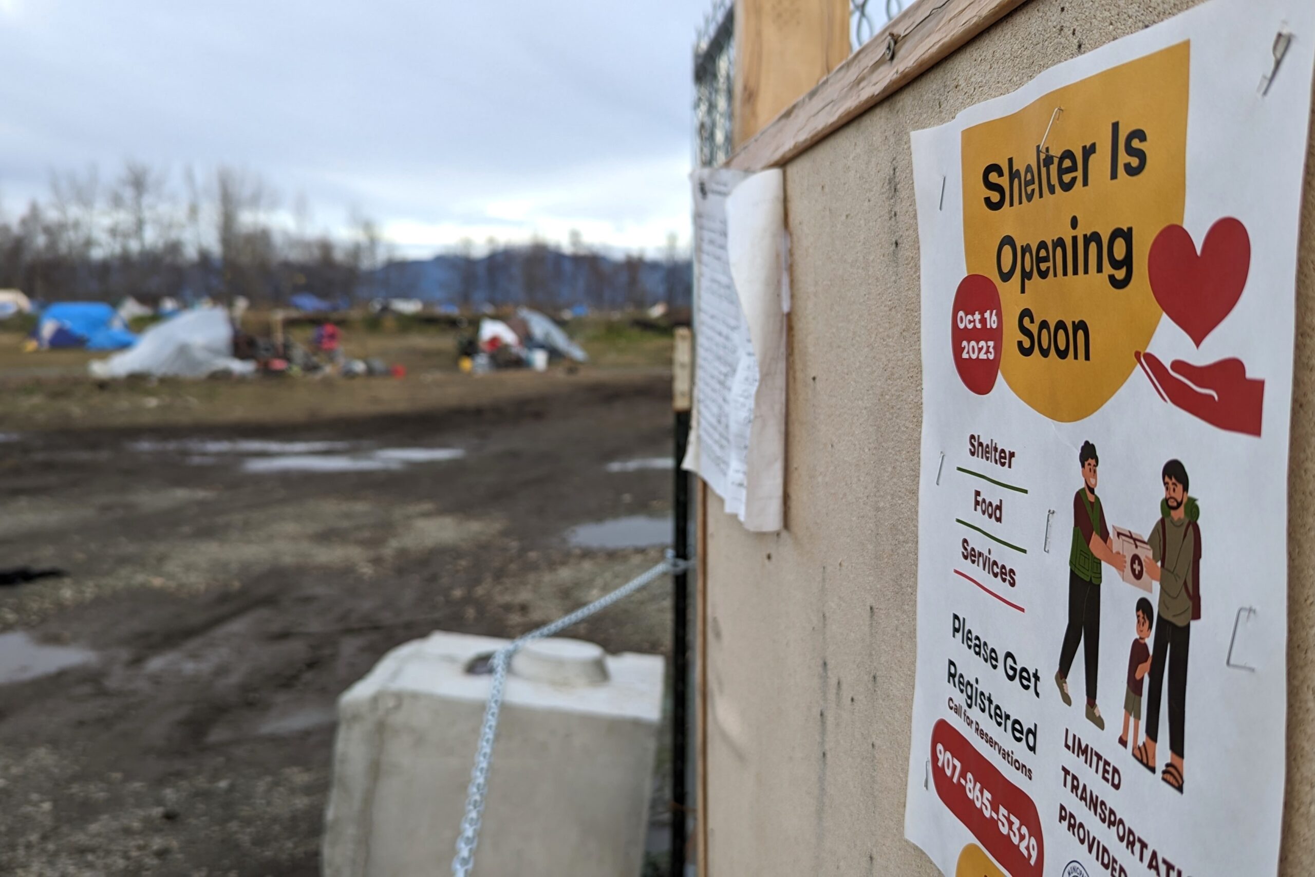 A flyer at an unofficial campground says "Shelter is opening soon"