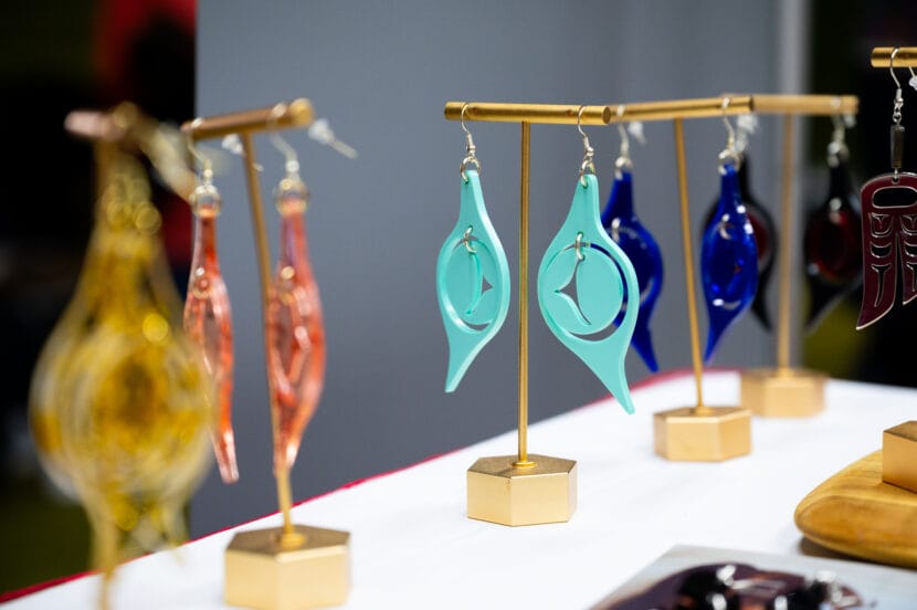 colorful earrings on table stands