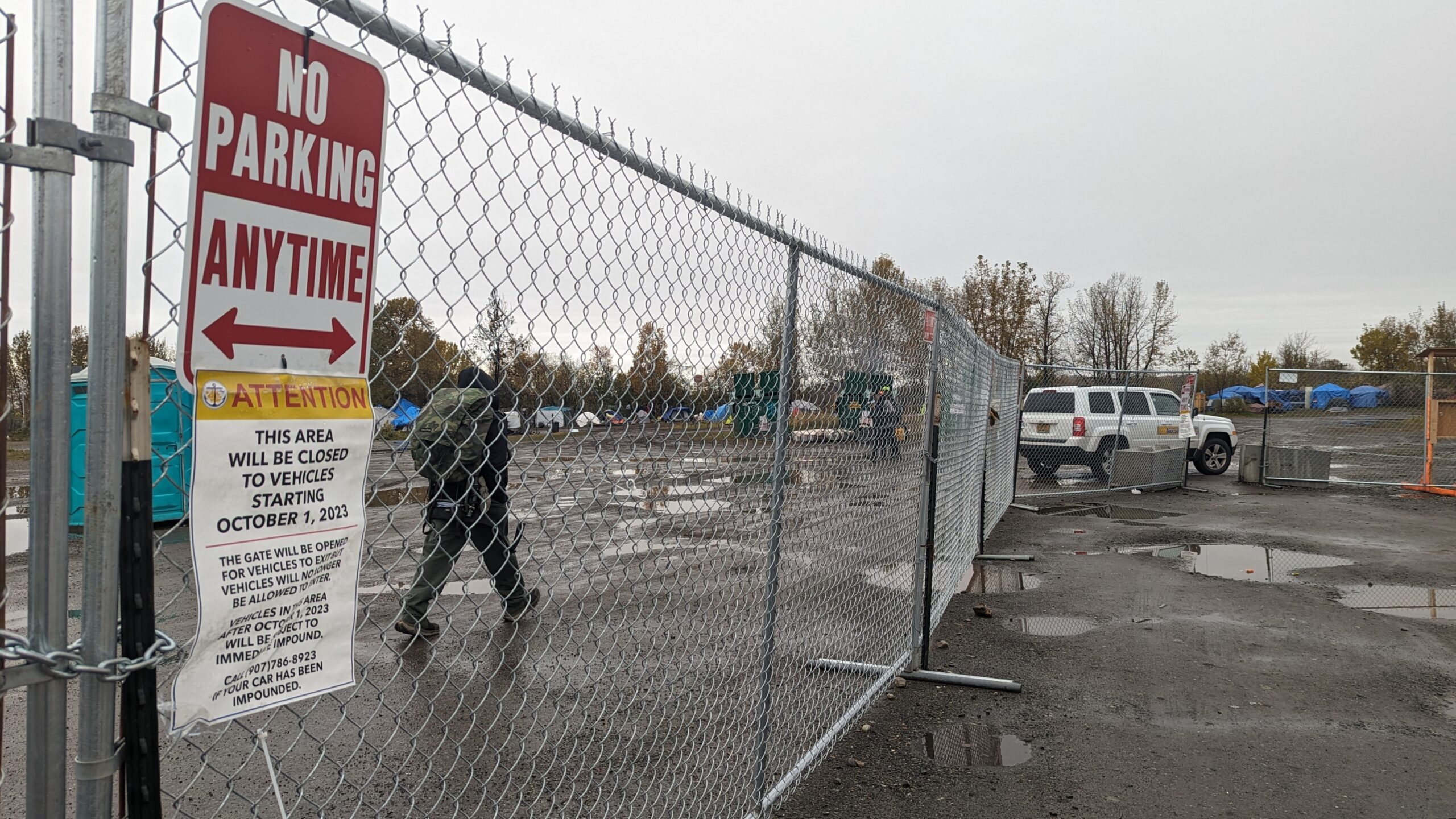 an impound notice is posted to a chainlink fence 