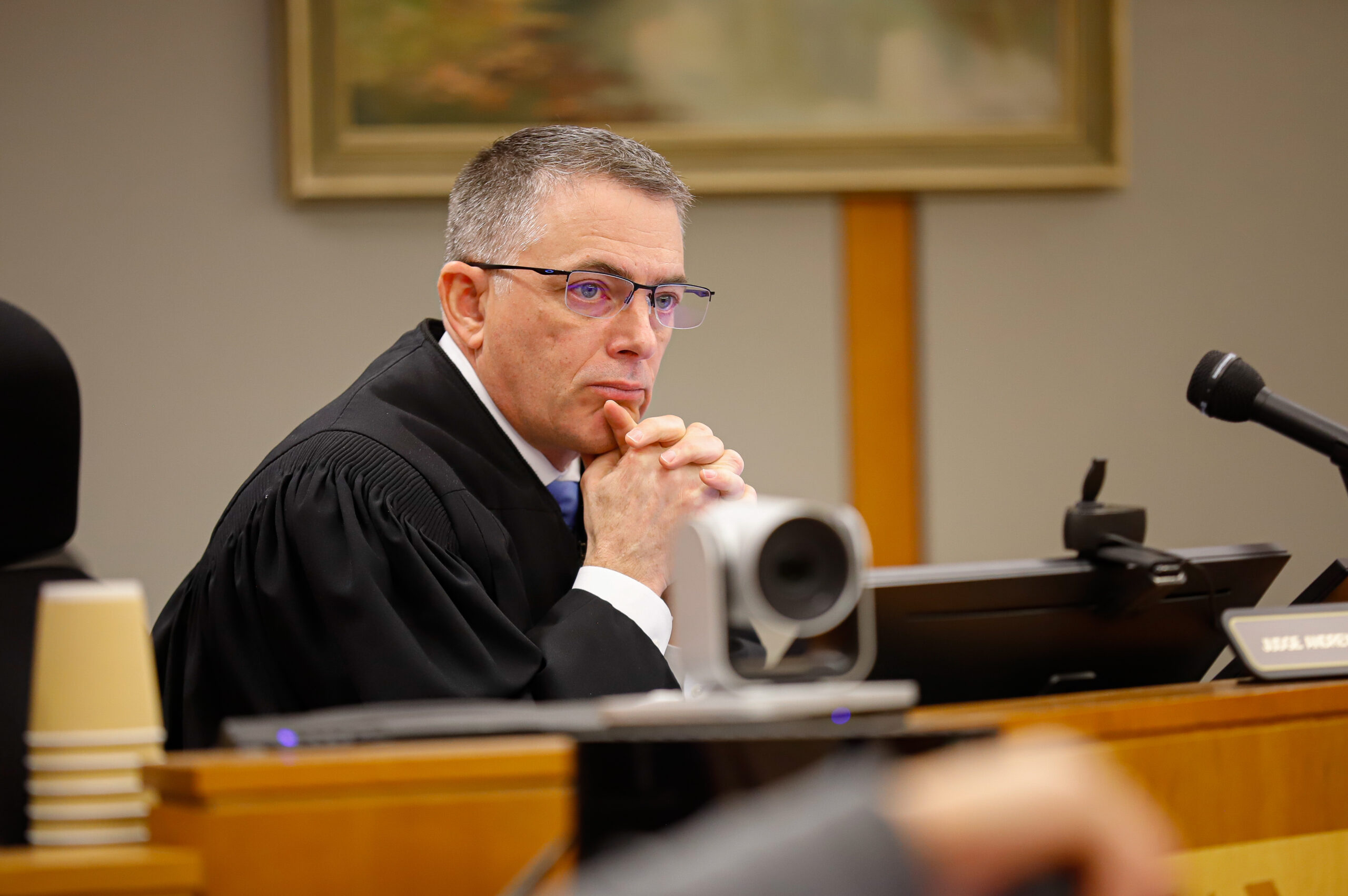A judge listens to court interviews