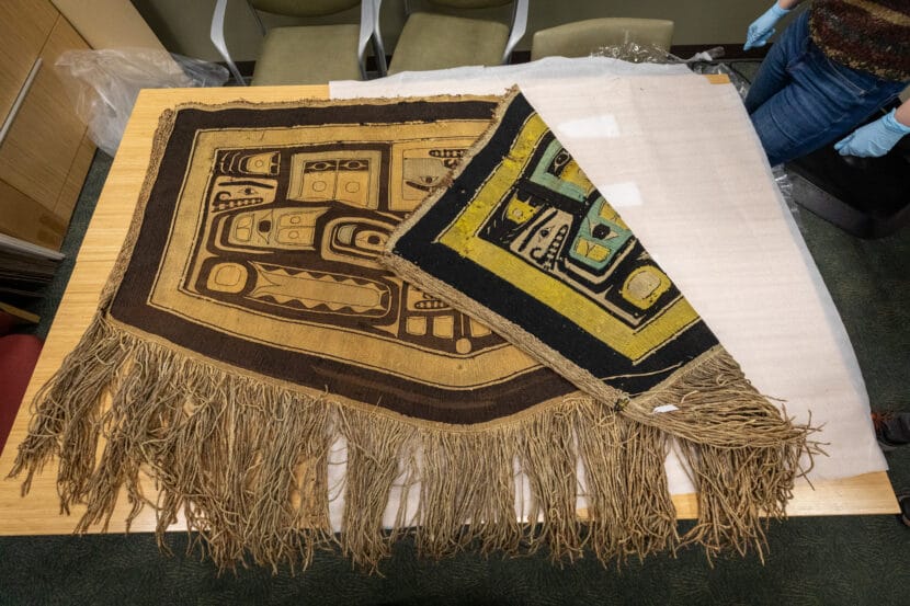 A Chilkat robe laid on a table