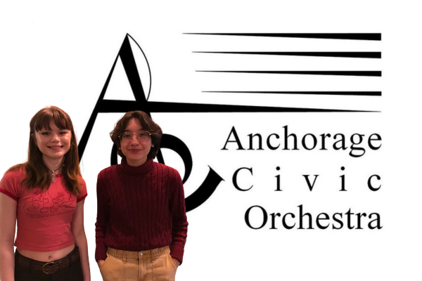 Two high school girls in front of the Anchorage Civic Orchestra logo.