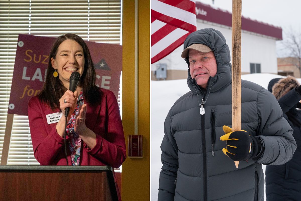 A smiling woman at a podium and a man holding a campaign sign with a snowy backdrop