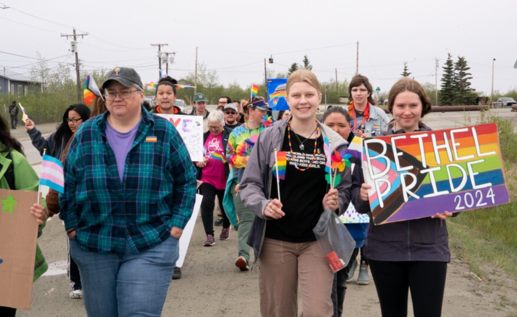 People march in a Pride parade in Bethel