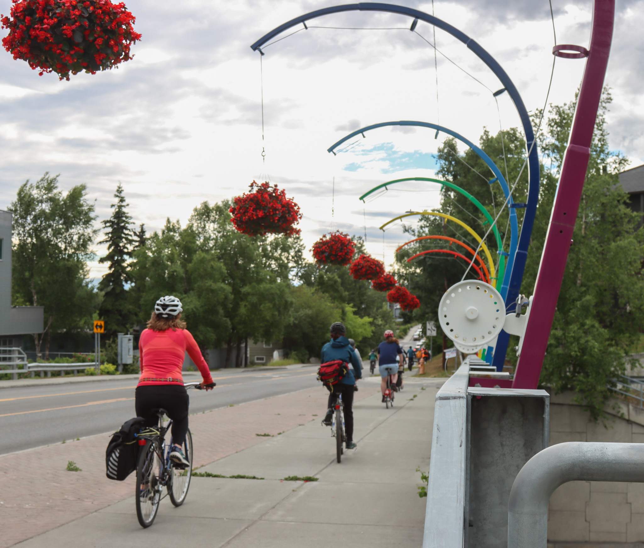 Bikers cross bridge