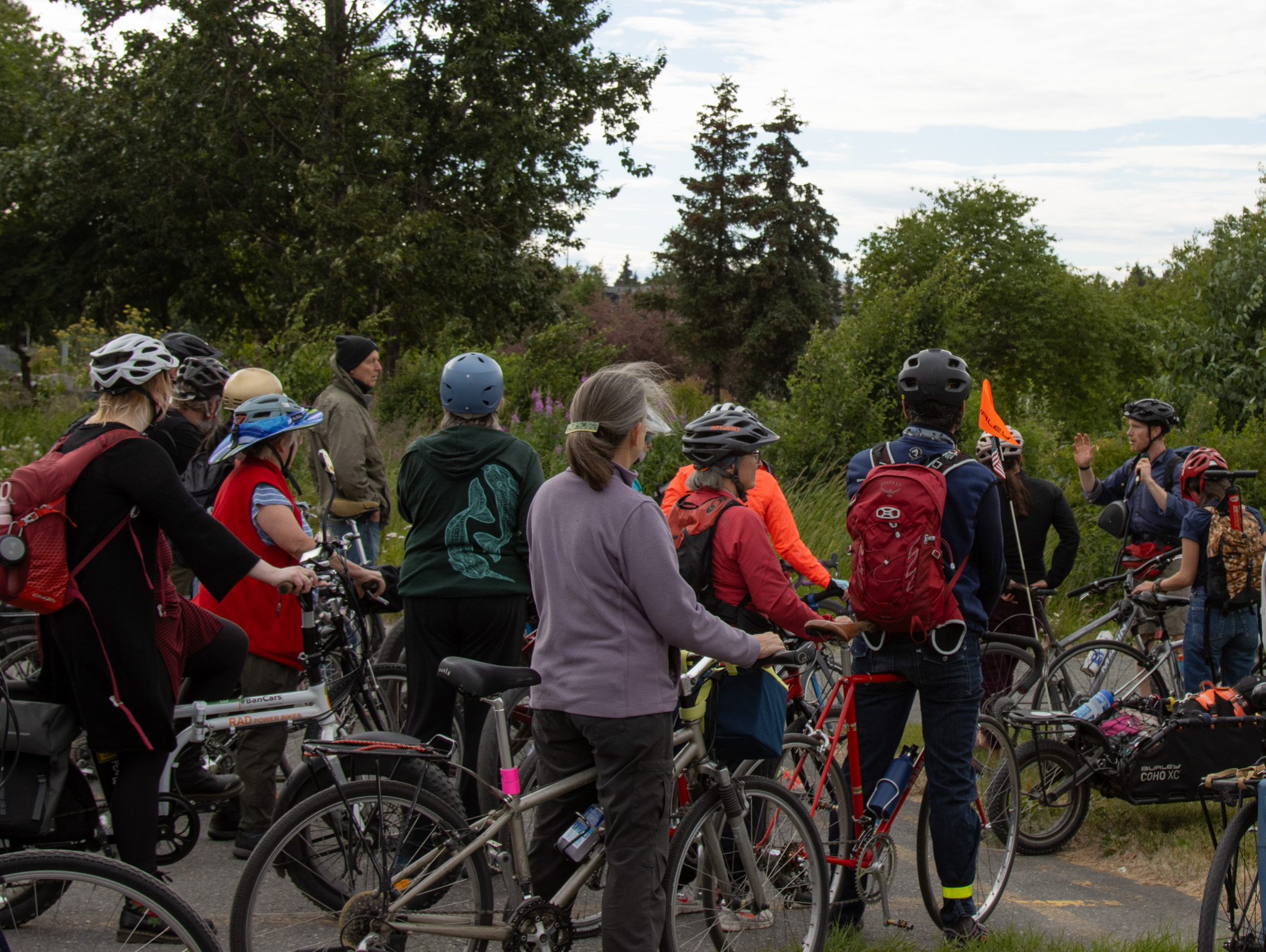 Man talks to a group of cyclists