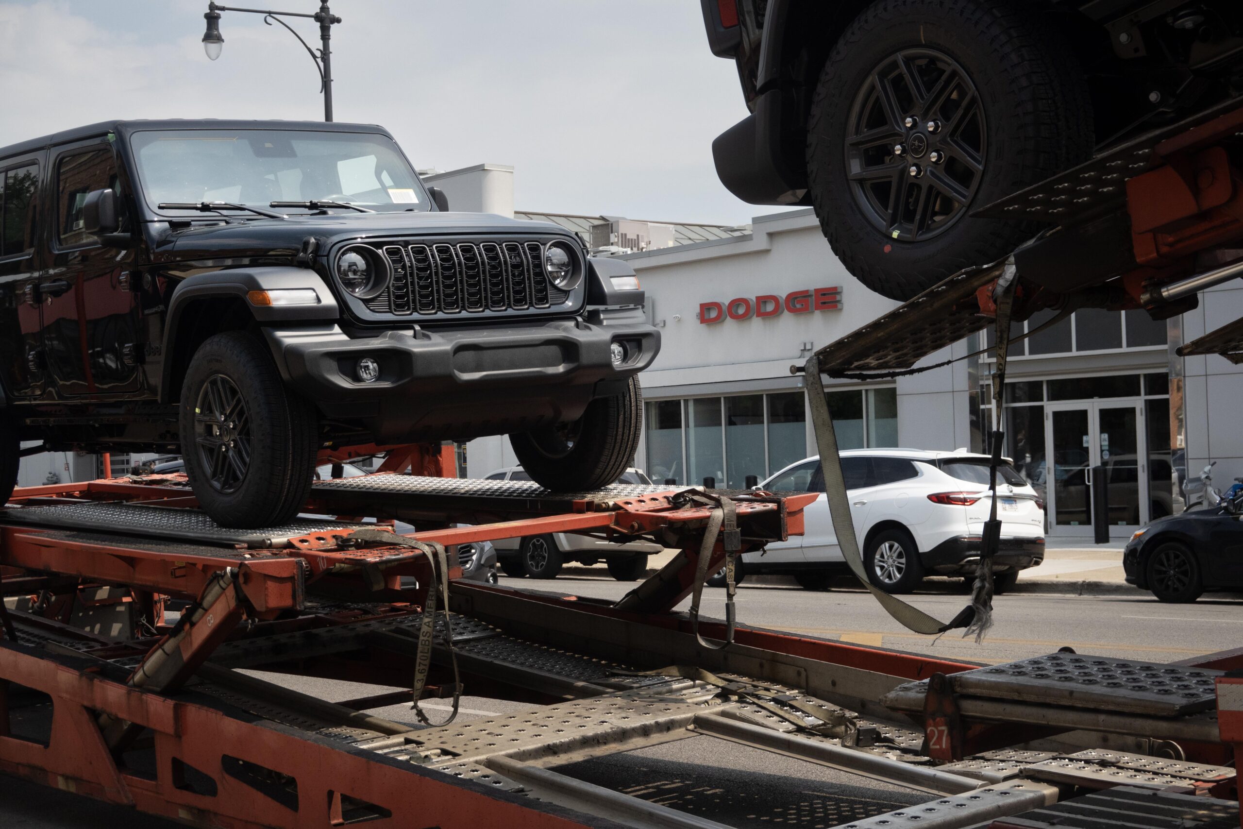a jeep getting delivered to a dealership