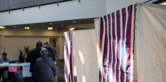 People waiting in line waiting to cast their vote.