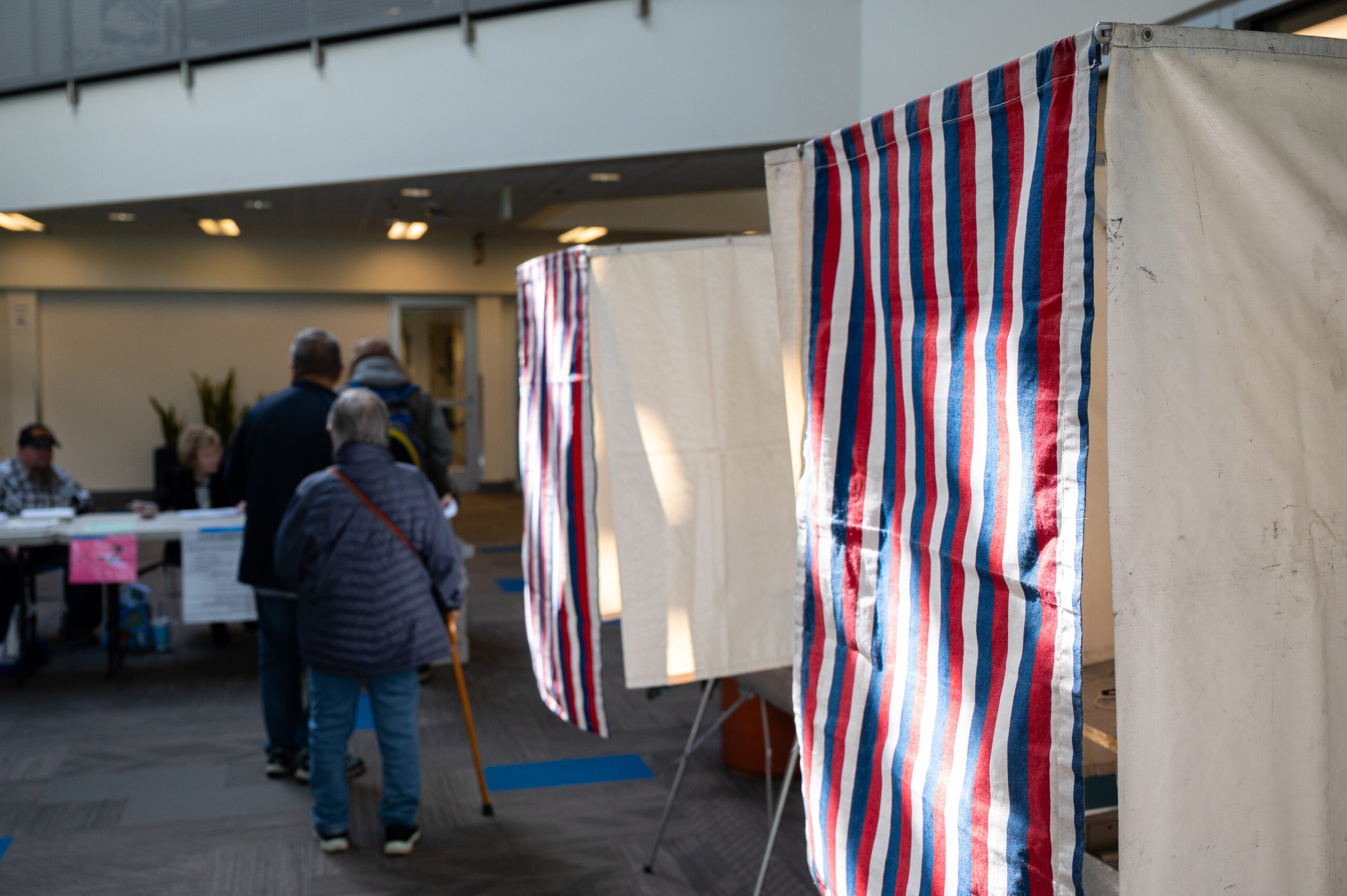 People waiting in line waiting to cast their vote.