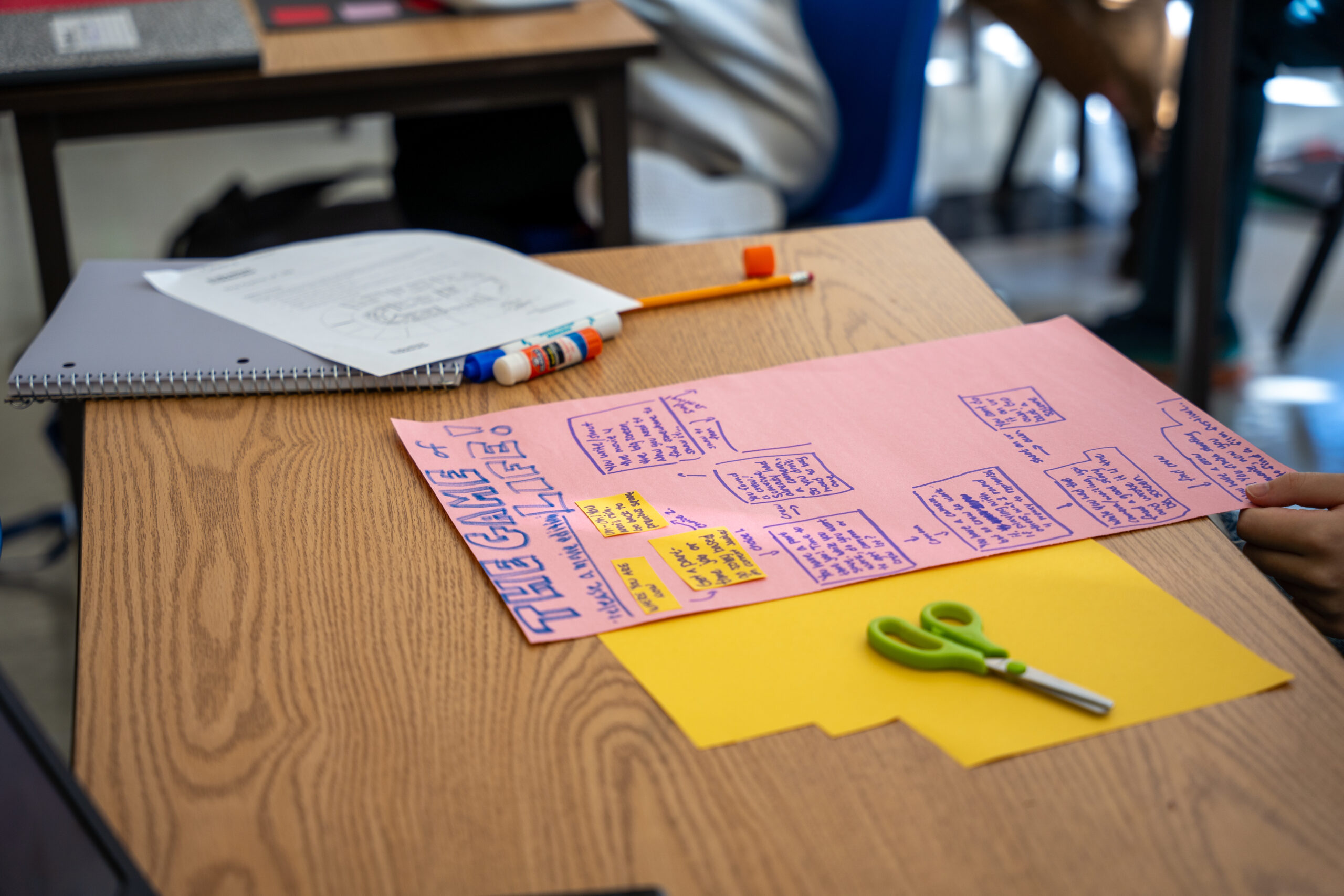 A student moving connected a insubstantial to make a committee game.