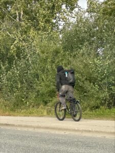 a person on a bicycle in black