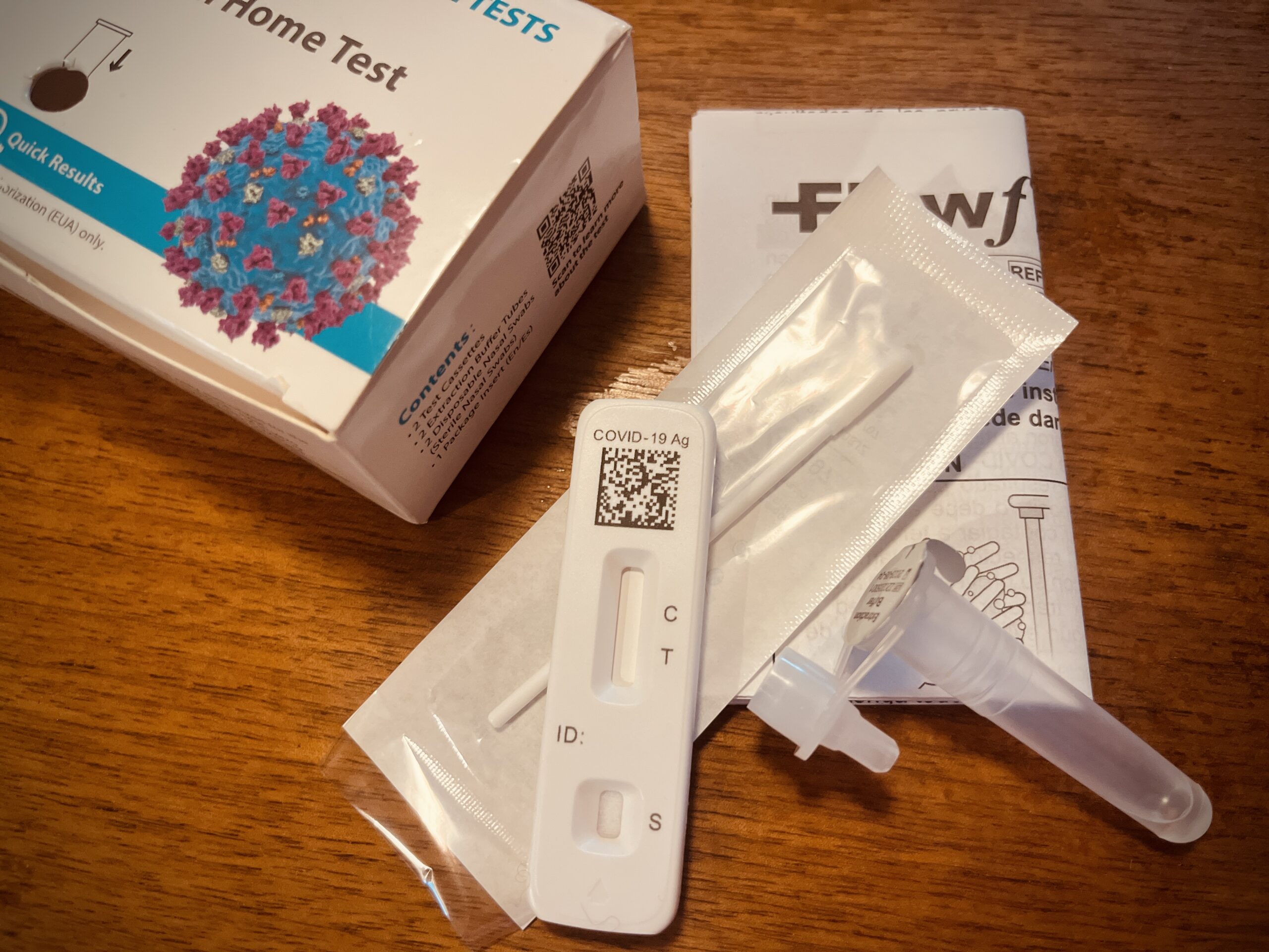 Parts of an unused COVID-19 at-home test.