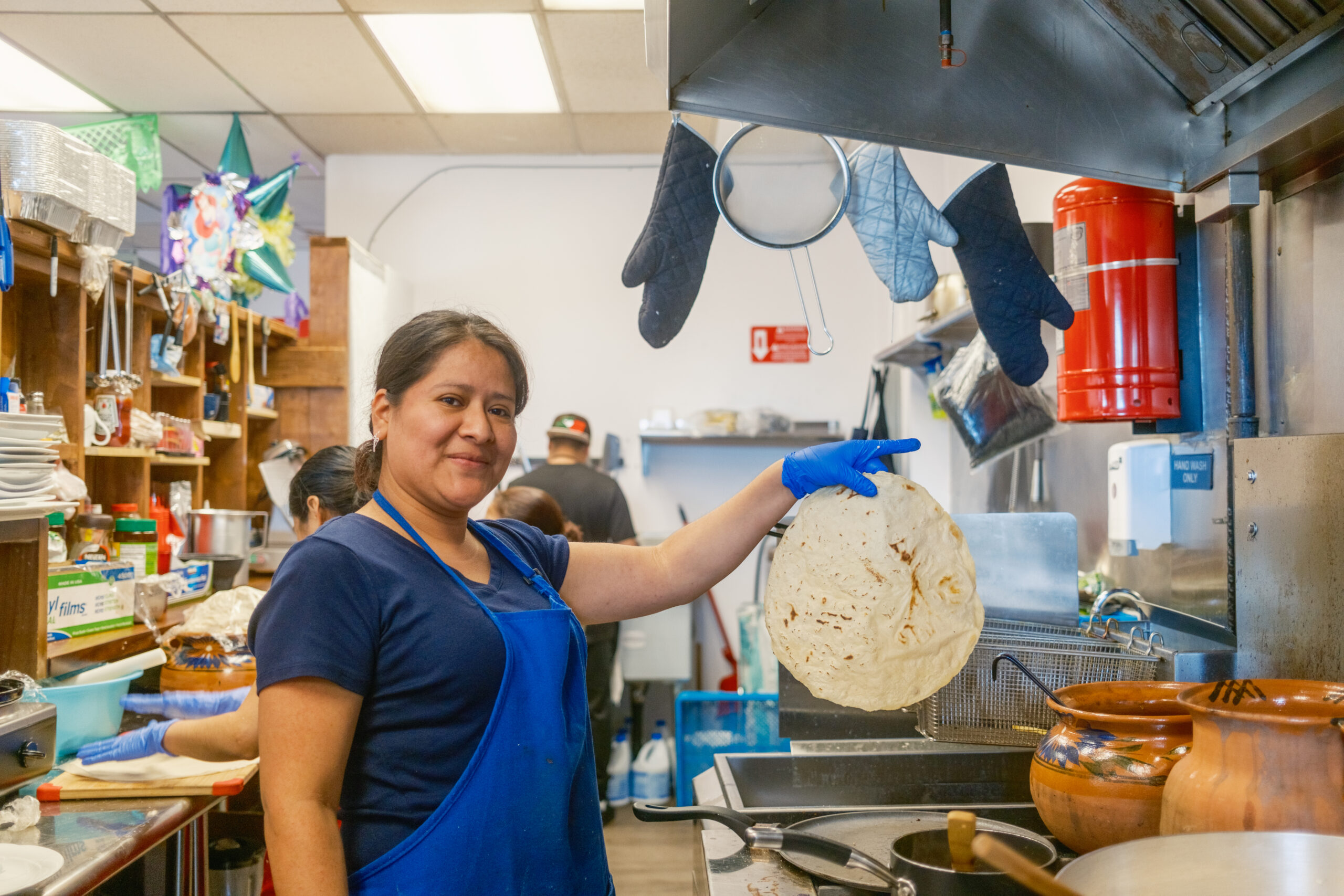 a personification holds up a tortilla