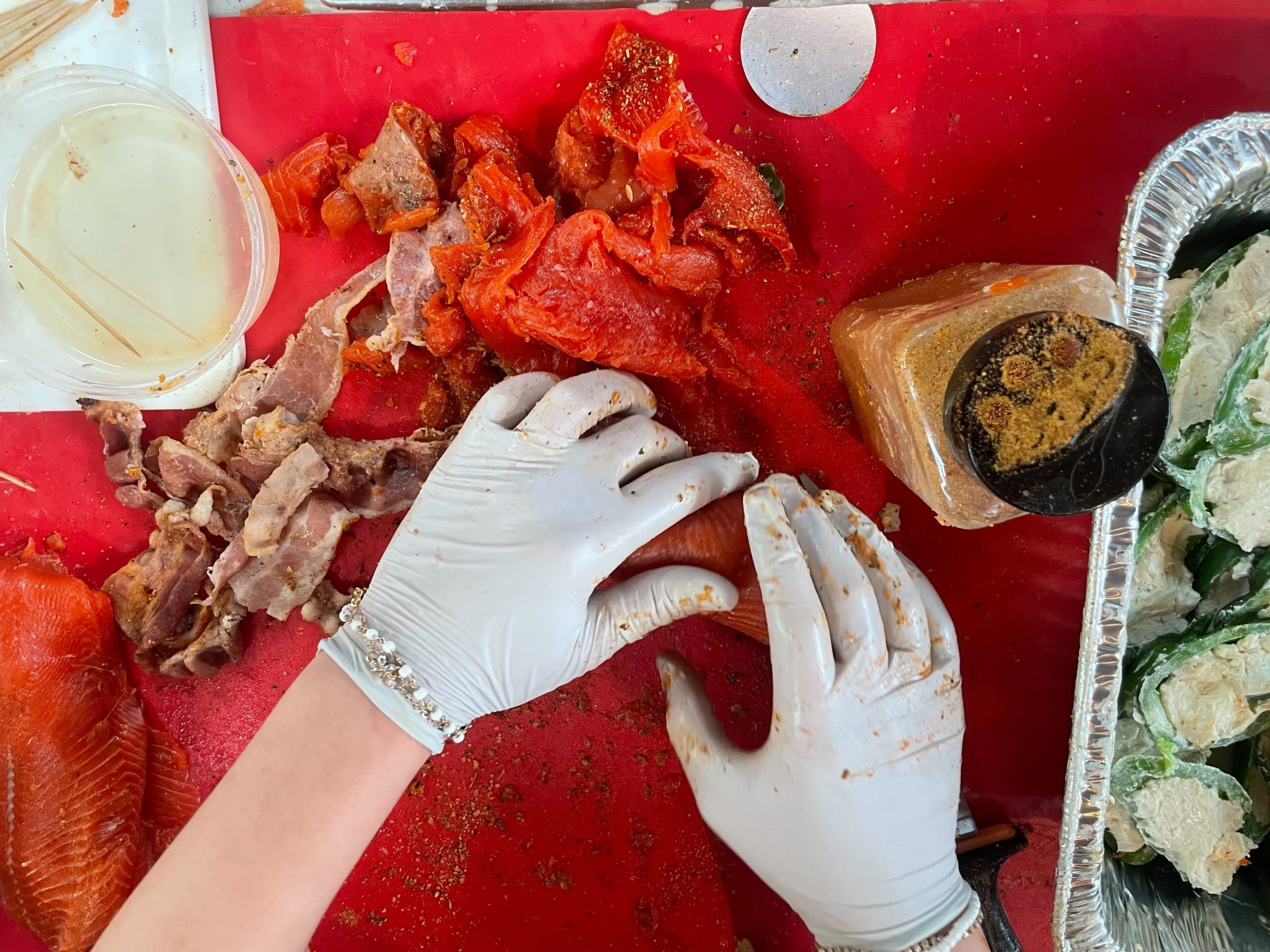 Hands touching salmon fillets