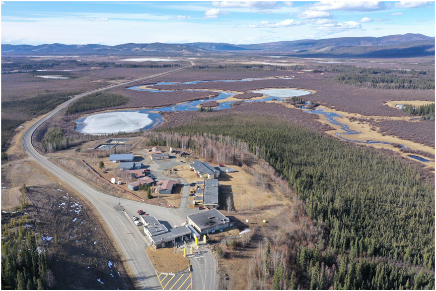 an aerial changeable of 10 to 12 buildings, astir of them are successful a circle astir 1 road, pinch 1 bigger building successful nan front. location are mini mountains successful nan inheritance and yo tin spot lakes and creeks and trees surrounding nan buildings.