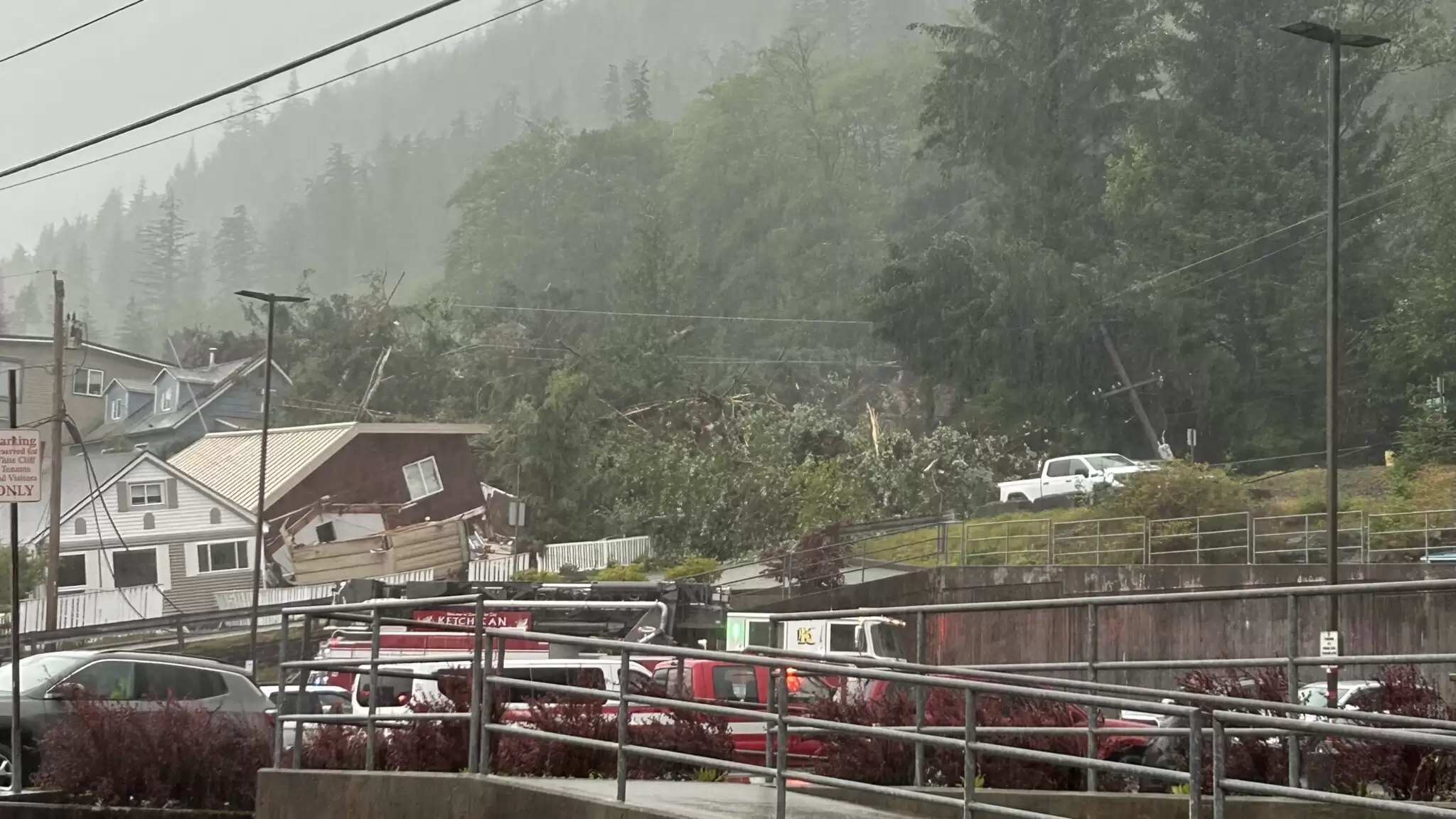 Houses hit by landslide debris