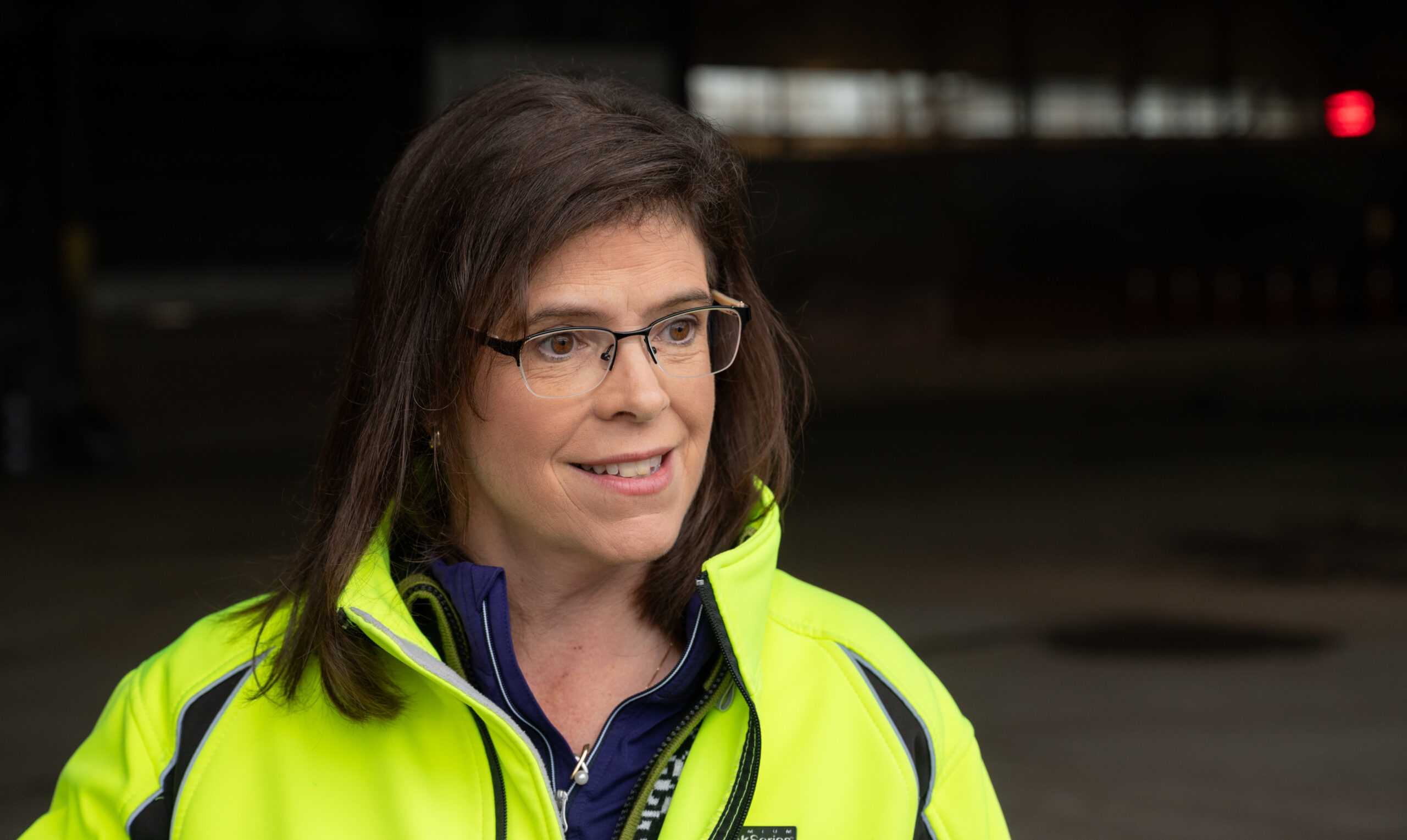 a woman in a bright green jacket