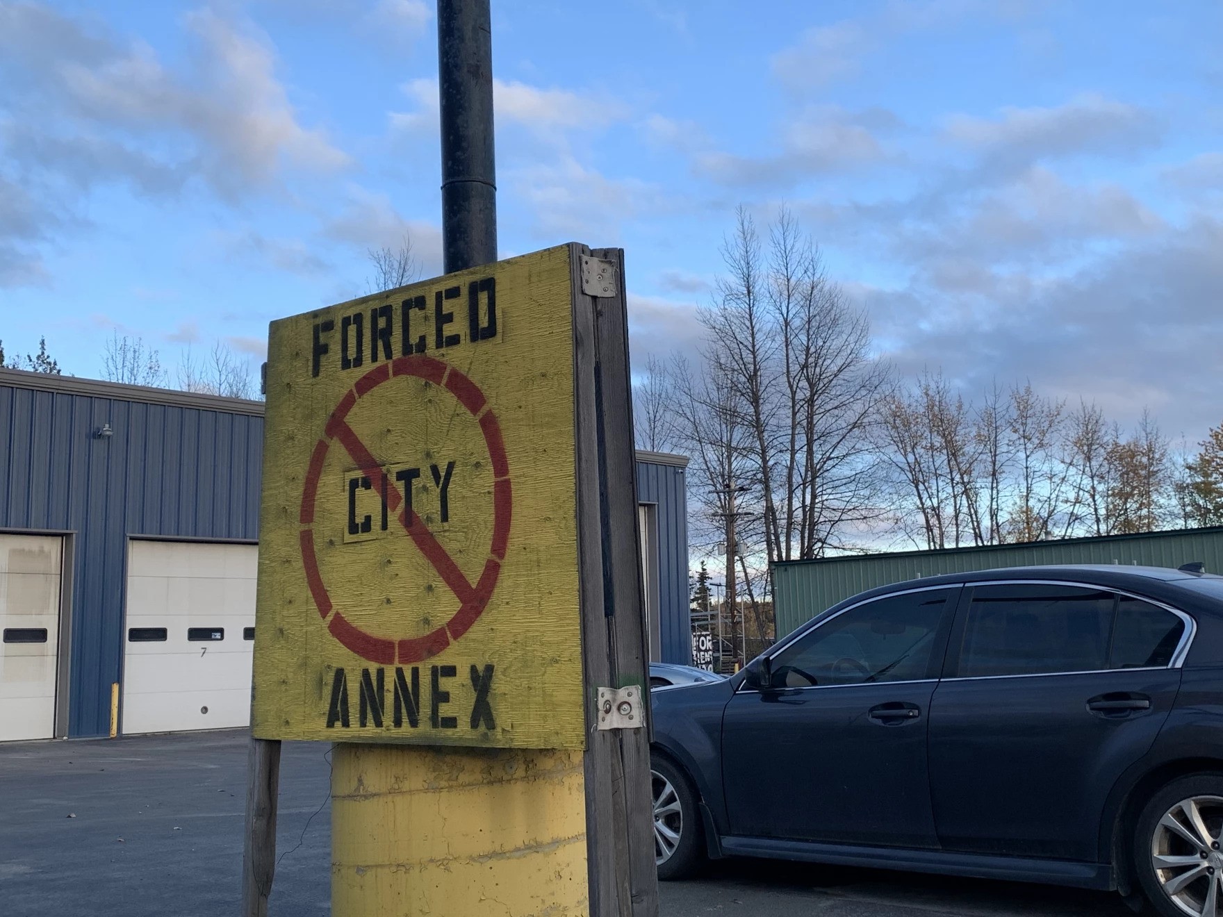 a sign says forced city annex with a cross through it