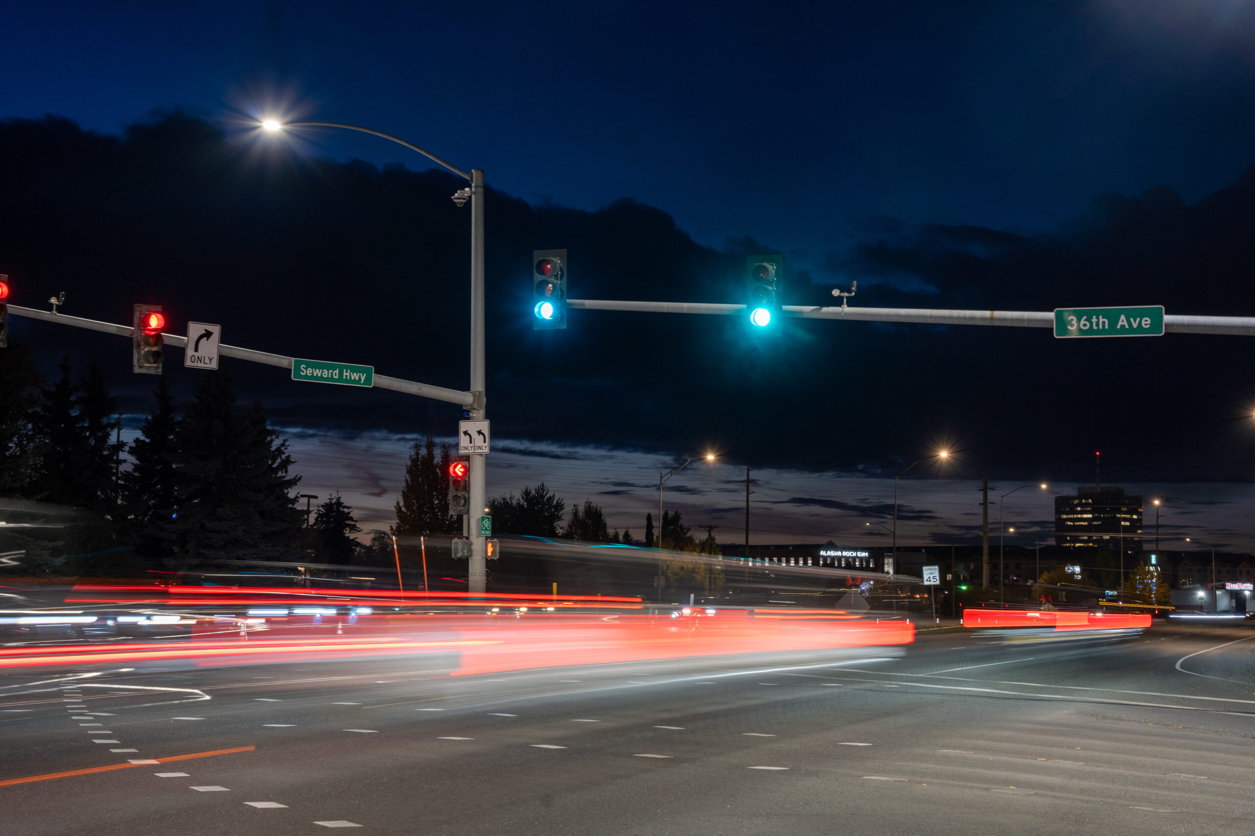 Street lights with cars going by.