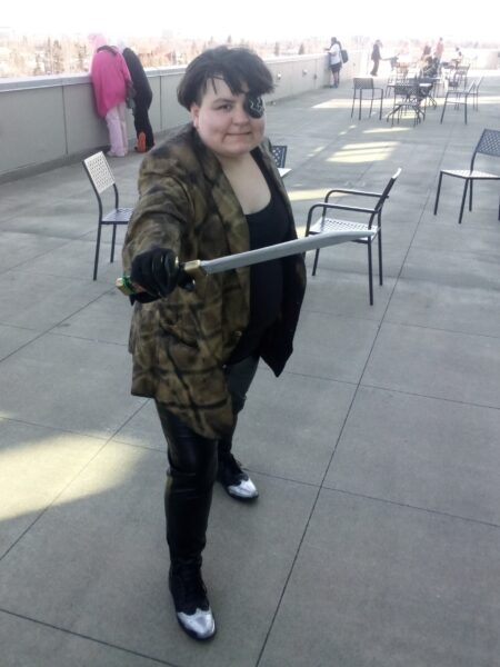 a female successful costume pinch an eyepatch and clone sword