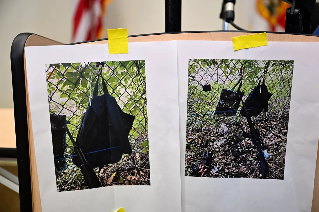 images of a backpack on a fence