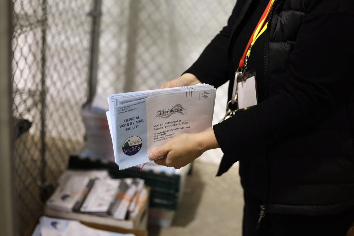 a person counting ballots