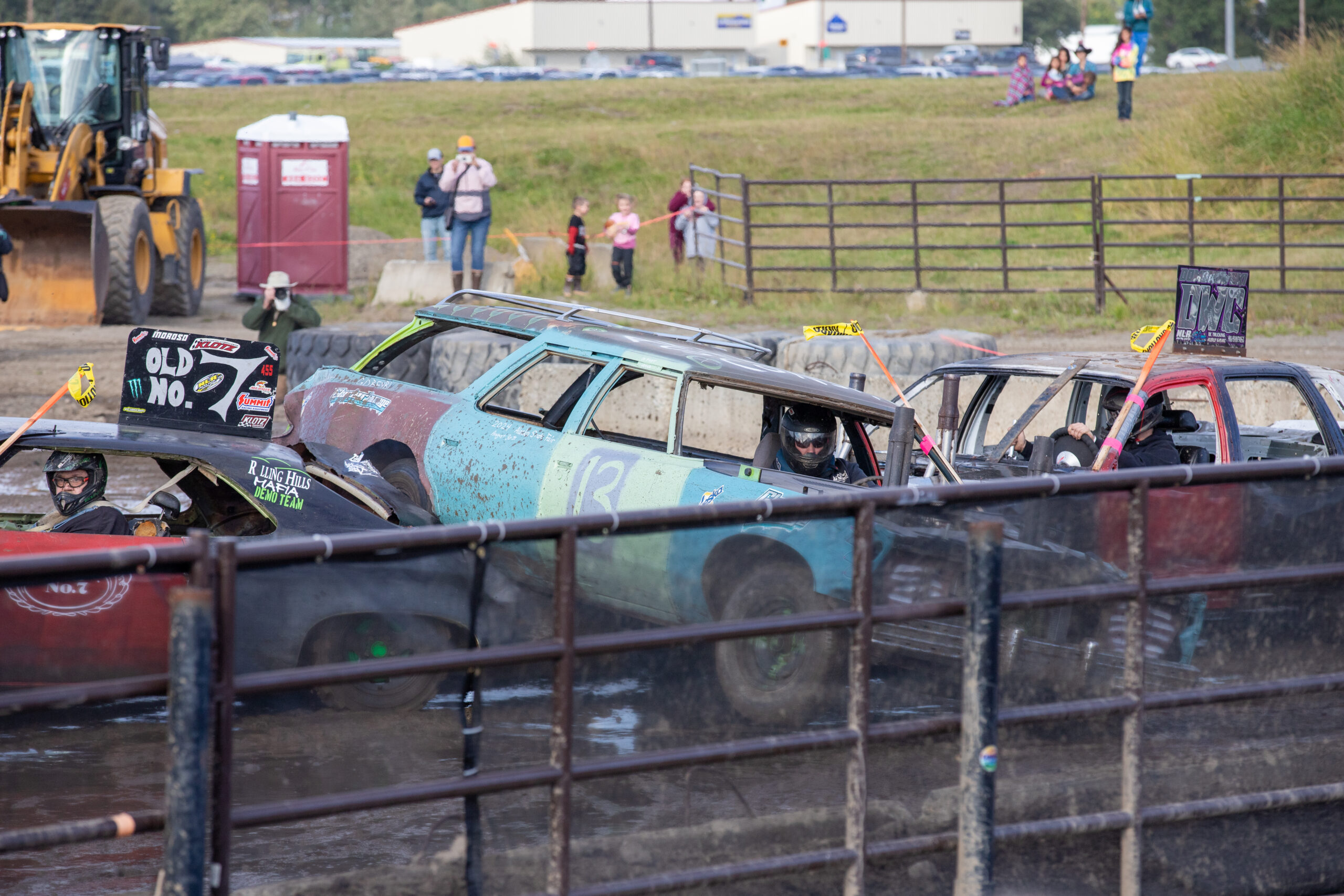 three cars collide, pinch nan mediate car going partially connected apical of nan car connected nan left.