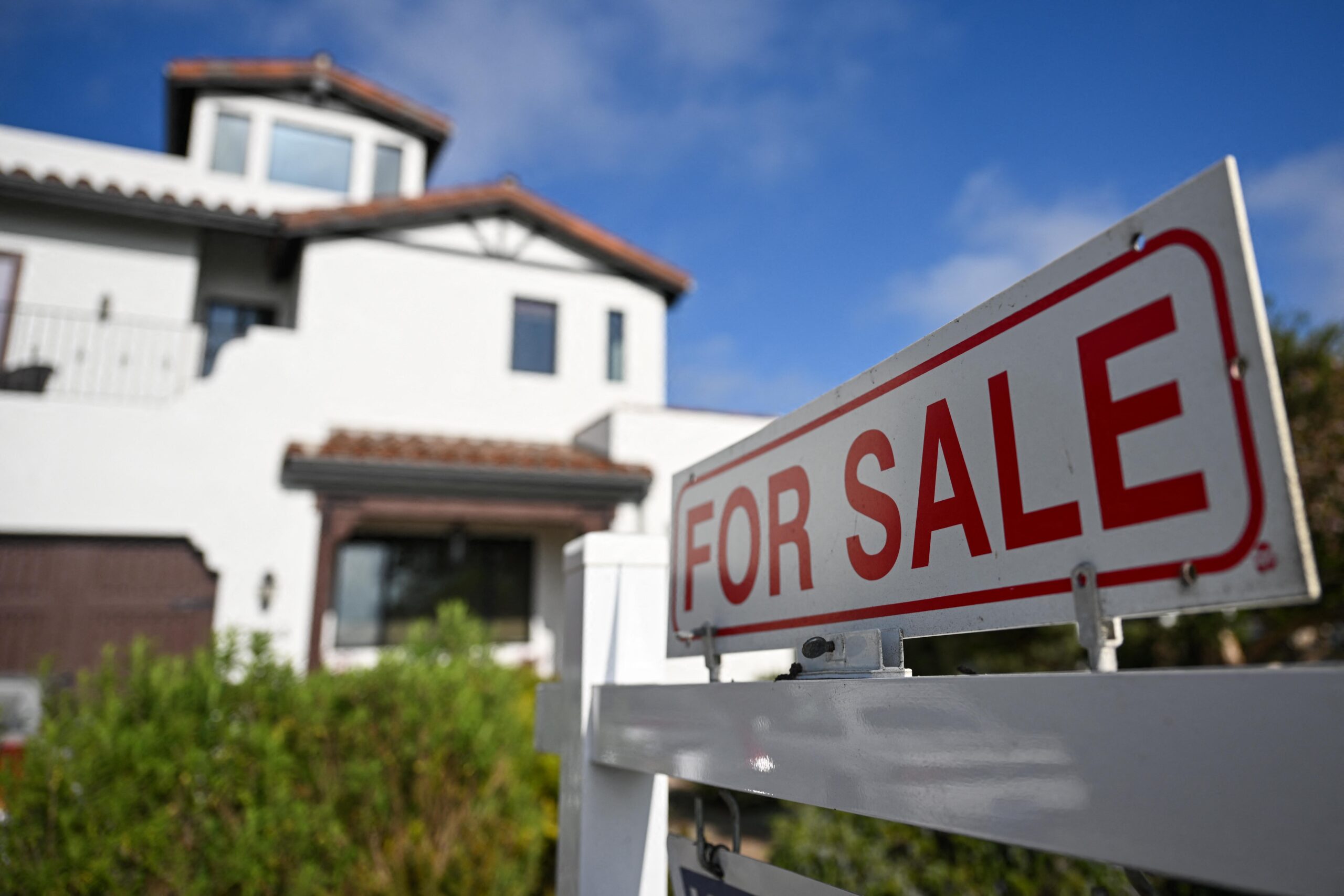 a house with a for sale sign