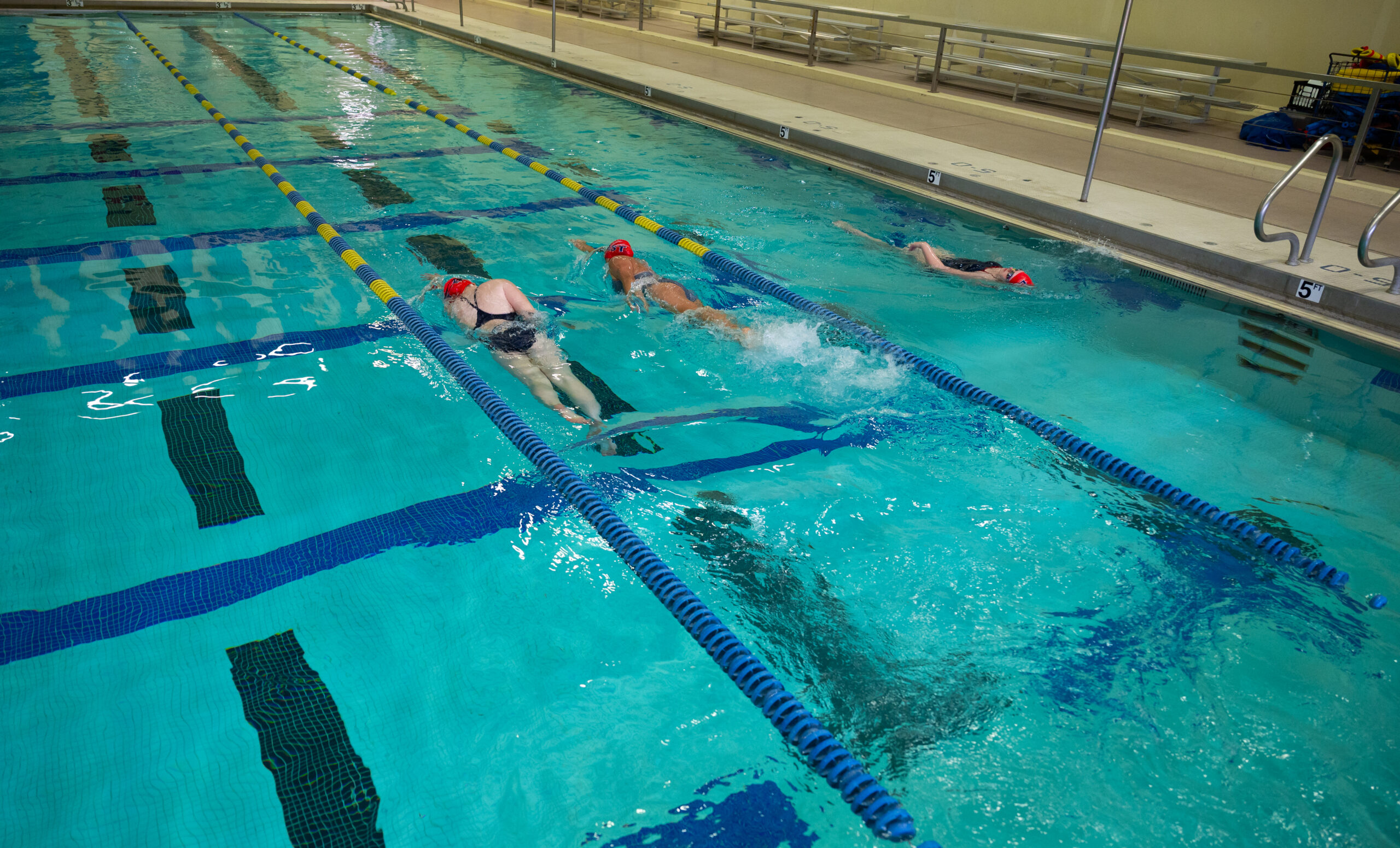 High school students in a swimming pool.