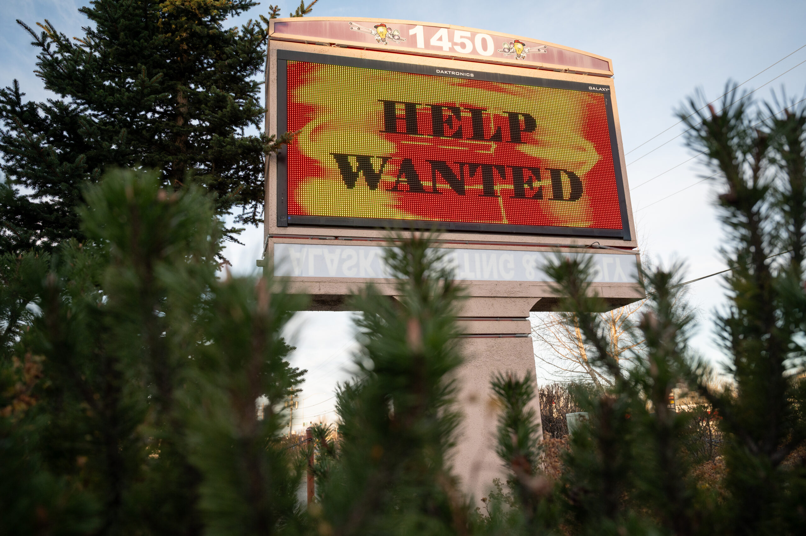 A sign that reads help wanted