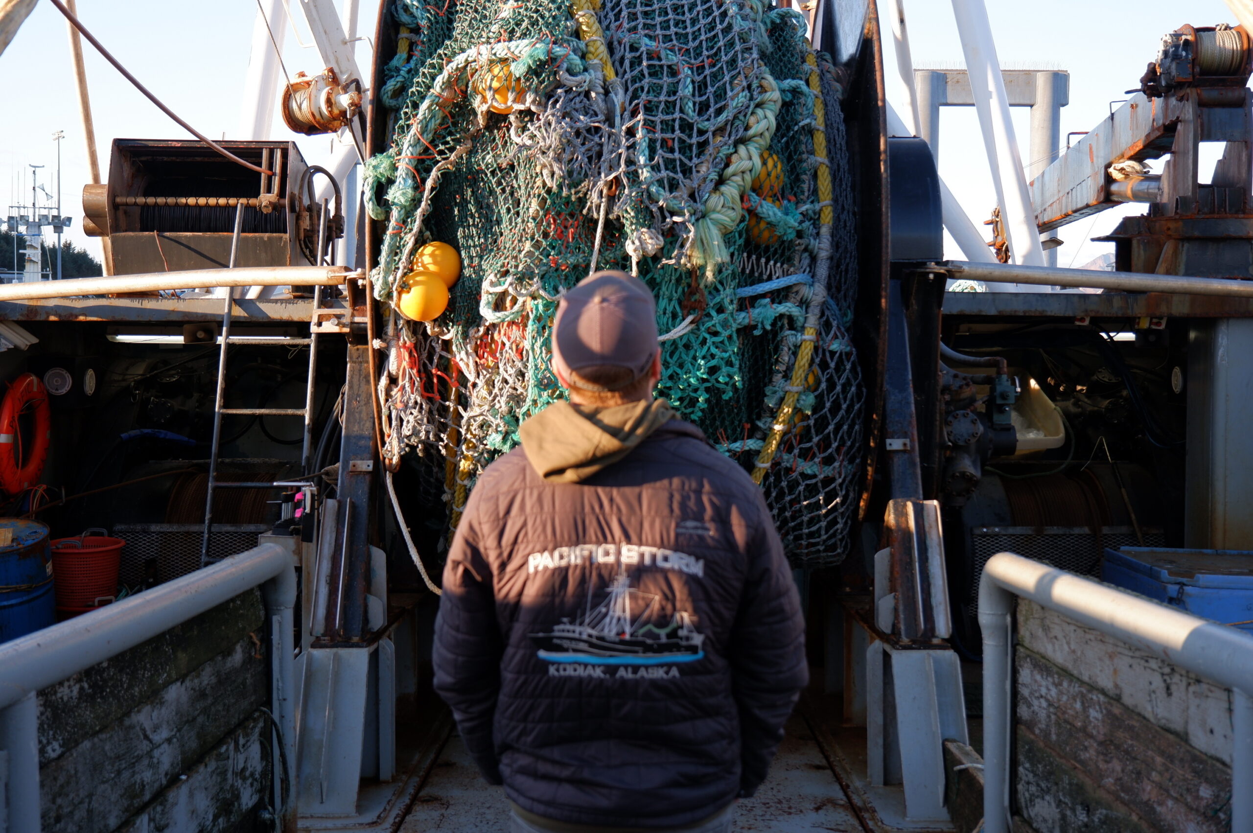 a man looking at fishing gear