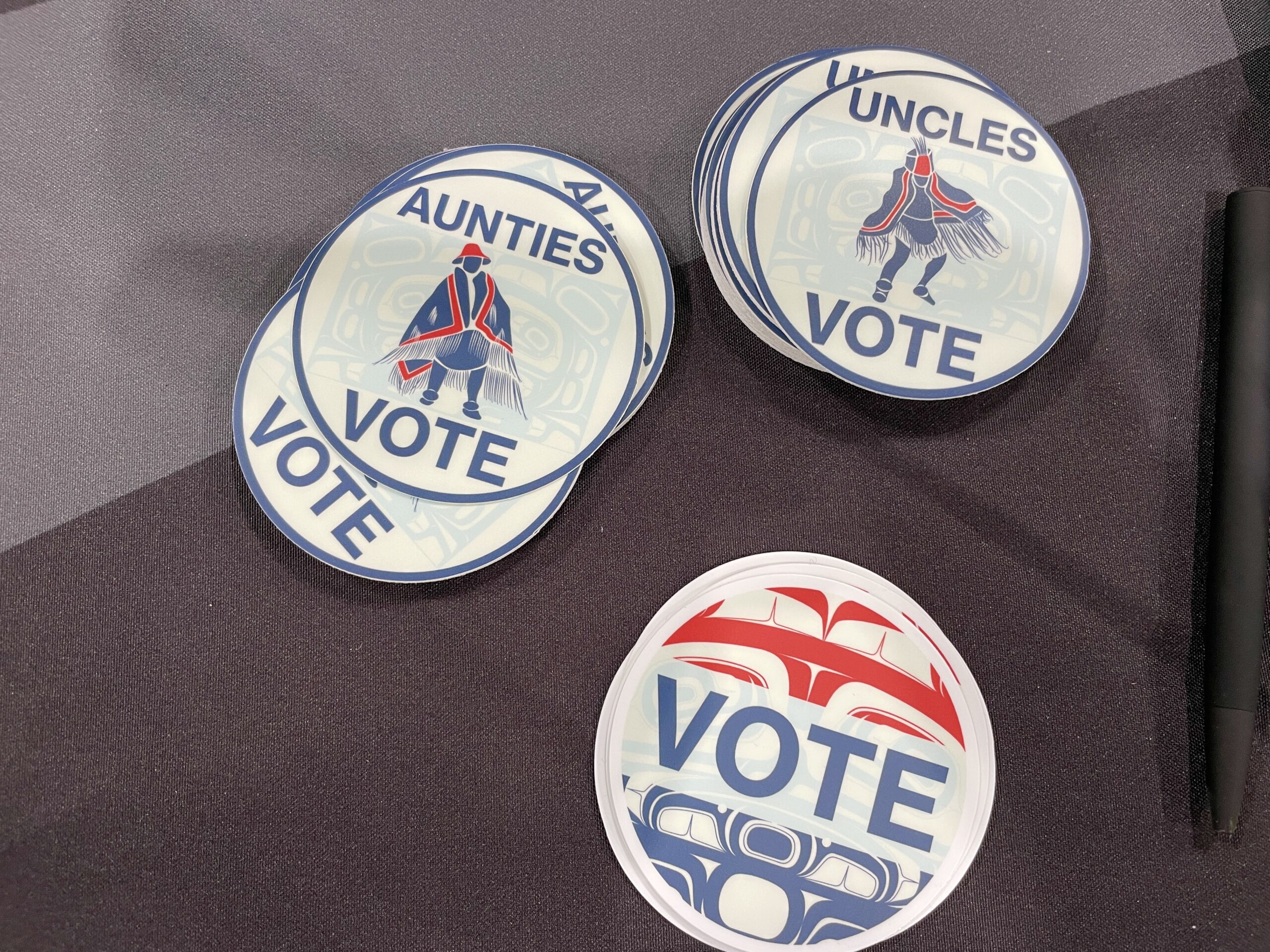 Three Southeast Alaska Native art-themed stickers promoting voting