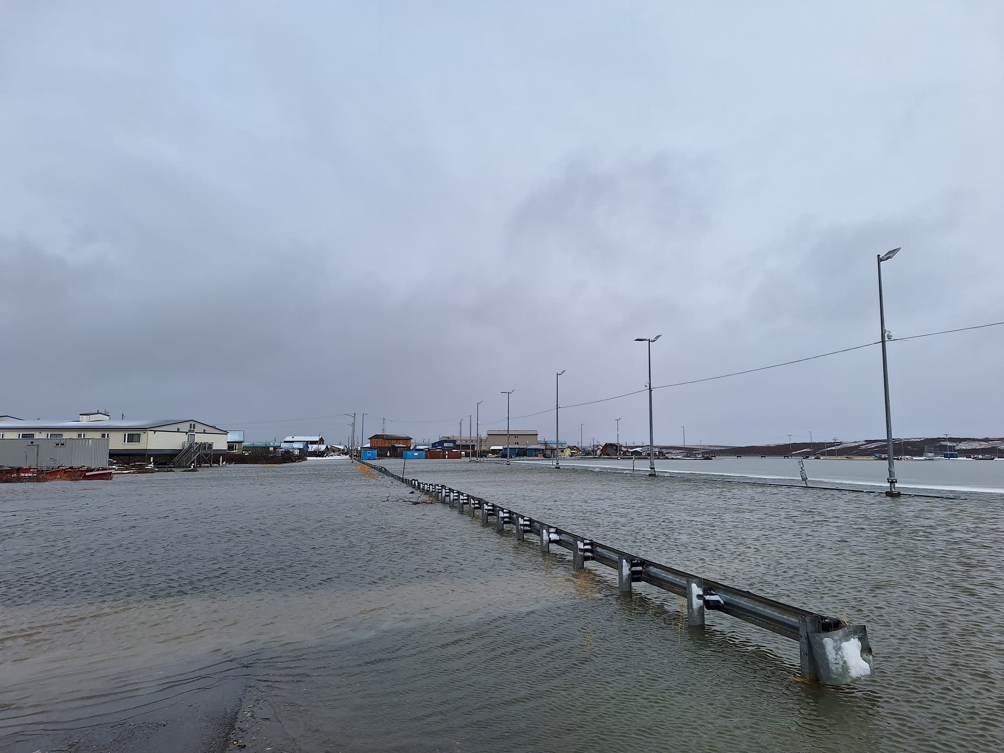 Water floods a road in Kotzebue.