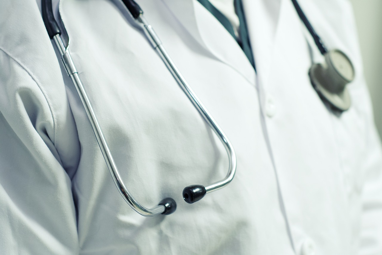 Close-up shot of a doctor with a stethoscope around their neck.