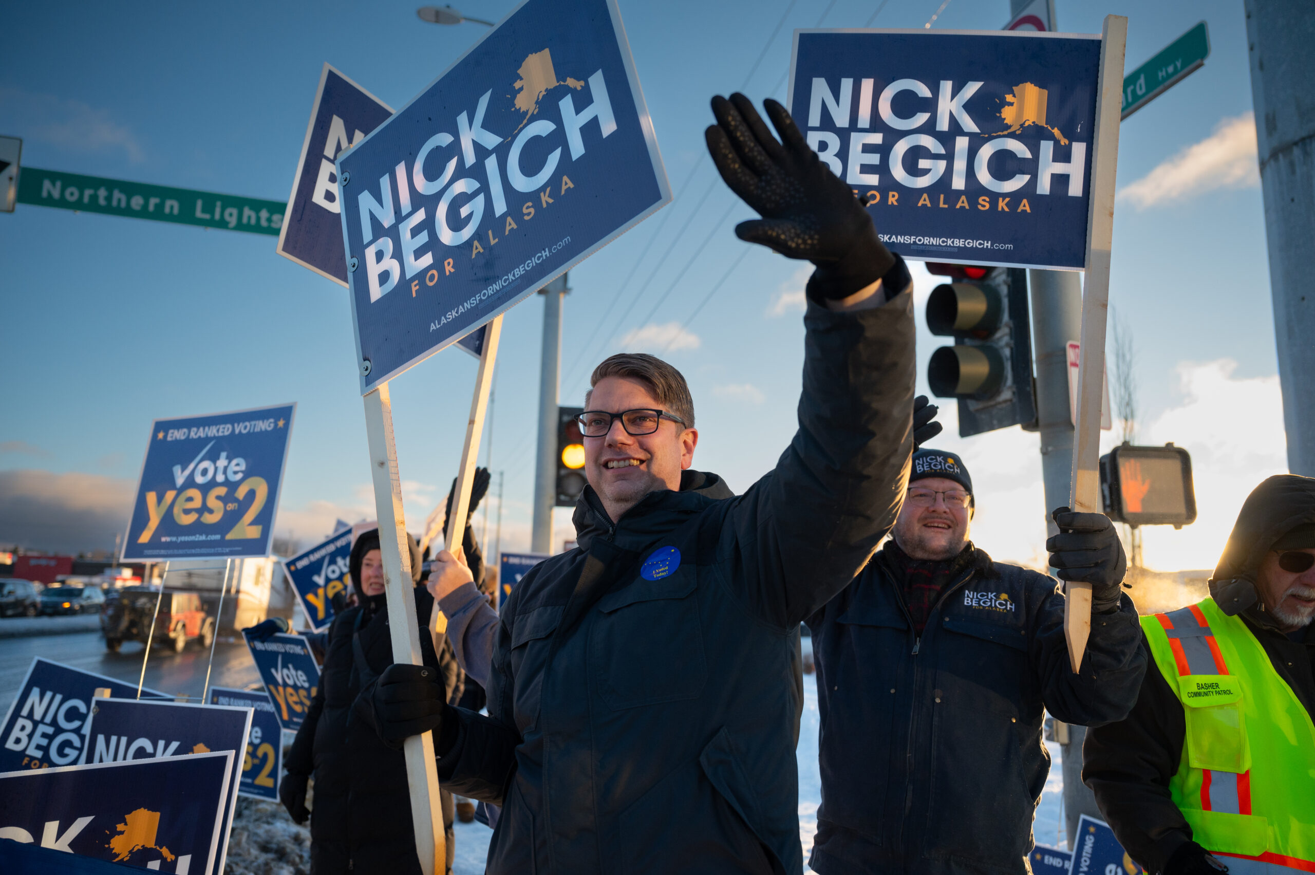 A man waving a sign.